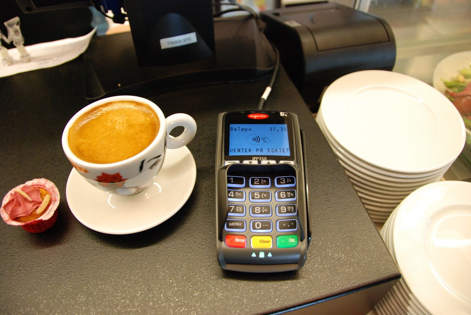 A real photo of a person making a mobile QR payment